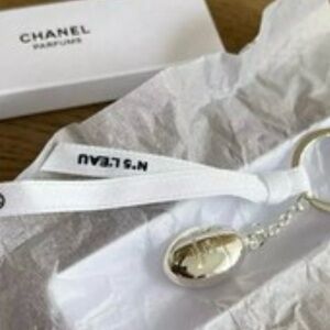 CHANEL L’Eau Silver Charm with White Ribbon